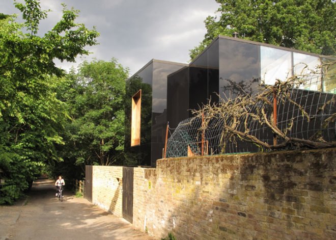 Ian McChesney, London architecture, black glass, glass facade, London architects, wood-burning stove, small houses, Victorian architecture London, Invisible home