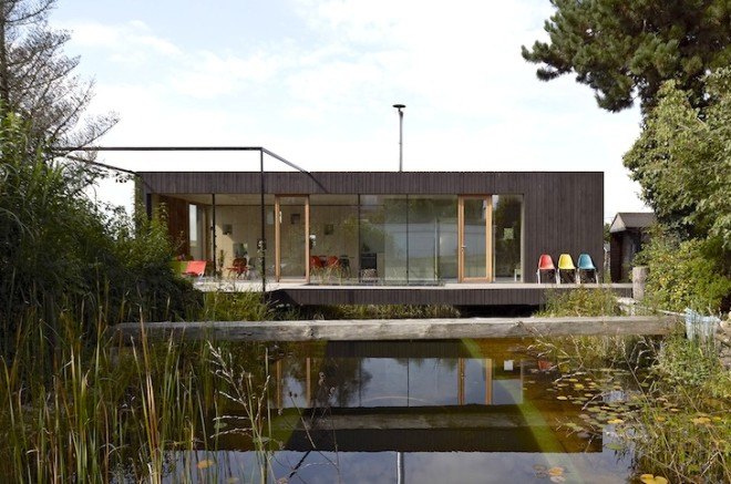 HPSA, Hammerschmid, Pachl, Seebacher Architekten, Teichhaus, spruce, Swedish mud color, Austria, Austrian architecture, natural swimming pool, elevated house, white oiled birch plywood, plywood, spruce board, gray fiberboard, open plan layout, natural light, minimal site disturbance, wooden deck