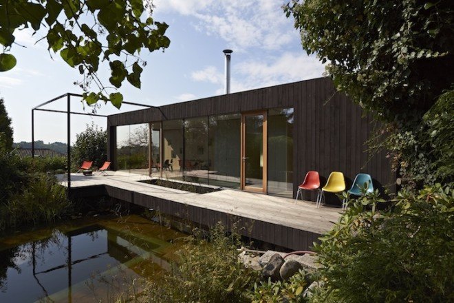 HPSA, Hammerschmid, Pachl, Seebacher Architekten, Teichhaus, spruce, Swedish mud color, Austria, Austrian architecture, natural swimming pool, elevated house, white oiled birch plywood, plywood, spruce board, gray fiberboard, open plan layout, natural light, minimal site disturbance, wooden deck