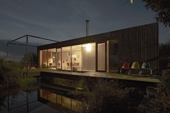 HPSA, Hammerschmid, Pachl, Seebacher Architekten, Teichhaus, spruce, Swedish mud color, Austria, Austrian architecture, natural swimming pool, elevated house, white oiled birch plywood, plywood, spruce board, gray fiberboard, open plan layout, natural light, minimal site disturbance, wooden deck
