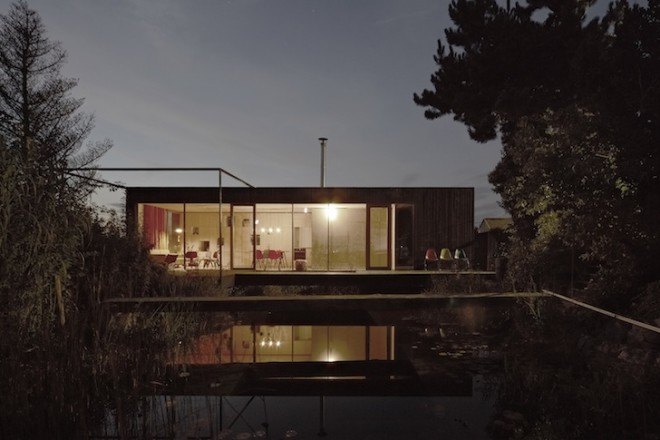 HPSA, Hammerschmid, Pachl, Seebacher Architekten, Teichhaus, spruce, Swedish mud color, Austria, Austrian architecture, natural swimming pool, elevated house, white oiled birch plywood, plywood, spruce board, gray fiberboard, open plan layout, natural light, minimal site disturbance, wooden deck