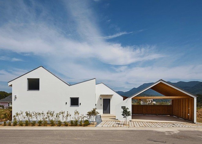 twin peaks house, south korea, mountain-inspired architecture, zigzag roof, apparat-c, children play space, open plan layout, gable roof, high ceilings,