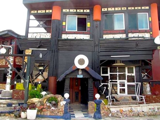 Wheel Story House, Ghana, Accra, Sammy Mensah Ansah, upcycle, reclaimed wood, recycled materials, reclaimed materials, house made from trash, trash construction materials, upcycled construction materials, west africa