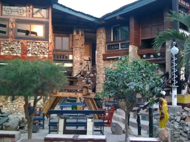 Wheel Story House, Ghana, Accra, Sammy Mensah Ansah, upcycle, reclaimed wood, recycled materials, reclaimed materials, house made from trash, trash construction materials, upcycled construction materials, west africa