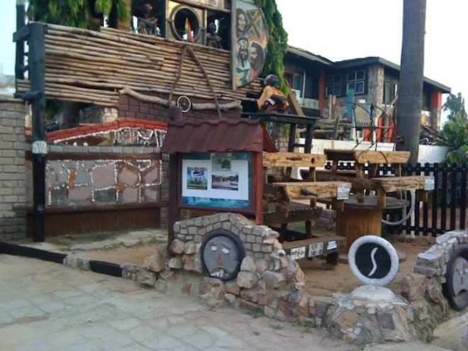 Wheel Story House, Ghana, Accra, Sammy Mensah Ansah, upcycle, reclaimed wood, recycled materials, reclaimed materials, house made from trash, trash construction materials, upcycled construction materials, west africa