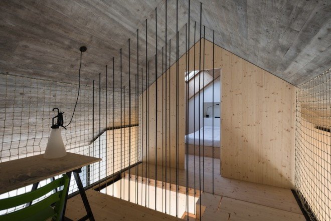 Dekleva Gregorič Arhitekti, Compact Karst House, Karst, Slovenia, Karst Plateau, stony house, monolithic architecture, contemporary architecture, untreated wood, wooden volumes, limestone, pitched roof, concrete, skylights