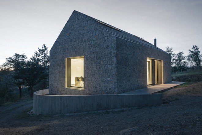 Dekleva Gregorič Arhitekti, Compact Karst House, Karst, Slovenia, Karst Plateau, stony house, monolithic architecture, contemporary architecture, untreated wood, wooden volumes, limestone, pitched roof, concrete, skylights