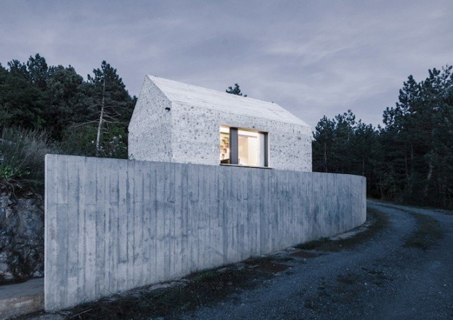 Dekleva Gregorič Arhitekti, Compact Karst House, Karst, Slovenia, Karst Plateau, stony house, monolithic architecture, contemporary architecture, untreated wood, wooden volumes, limestone, pitched roof, concrete, skylights
