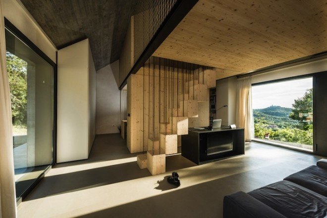 Dekleva Gregorič Arhitekti, Compact Karst House, Karst, Slovenia, Karst Plateau, stony house, monolithic architecture, contemporary architecture, untreated wood, wooden volumes, limestone, pitched roof, concrete, skylights