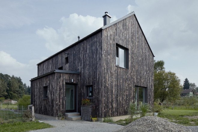 Carbon House, Mjölk Architekti, timber home, timber house, Pyšely, timber facade, charred timber, charred timber plans, timber planks, natural light, whitewashed walls, exposed timber ceiling beams, timber ceiling beams,