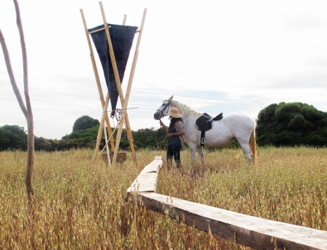 Gartnerfuglen, Grooming Retreat, horse grooming, Marian de Delás, horses, spain, timber structure, elevated structure, horse station, mosquito net, white netting, natural light, barley field, timber platform, Mallorca