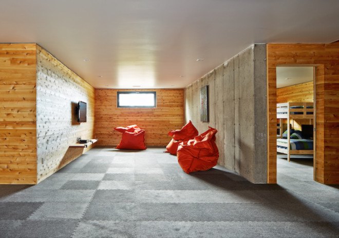 MU architects, open tread stairs, Malbaie VIII Residence La Grange, Malbaie VIII, St. Lawrence River, white cedar, dark gray metal, metal cladding, timber home, Charlevoix, outdoor terrace, barn-inspired architecture, cathedral ceiling, natural light,