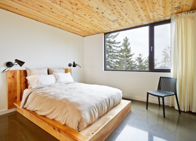 MU architects, open tread stairs, Malbaie VIII Residence La Grange, Malbaie VIII, St. Lawrence River, white cedar, dark gray metal, metal cladding, timber home, Charlevoix, outdoor terrace, barn-inspired architecture, cathedral ceiling, natural light,