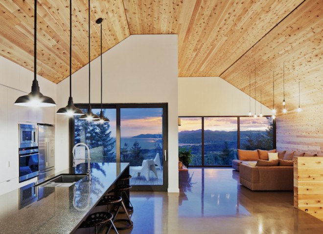 MU architects, open tread stairs, Malbaie VIII Residence La Grange, Malbaie VIII, St. Lawrence River, white cedar, dark gray metal, metal cladding, timber home, Charlevoix, outdoor terrace, barn-inspired architecture, cathedral ceiling, natural light,