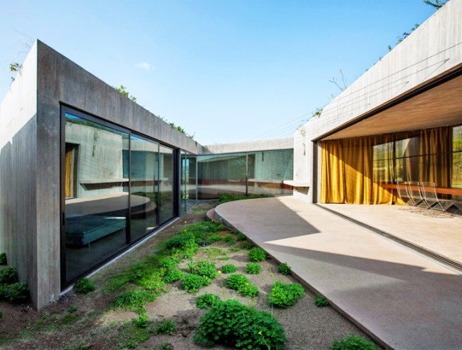 Tense Architecture Network, concrete home, residence in Megara, Greece, Greek architects, courtyard, concrete house, glass facade, open-plan living room, olive grove, green architecture