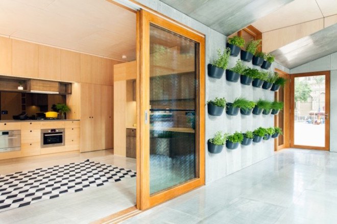 Archiblox, sunroom, carbon positive house, carbon positive, prefab, prefab house, carbon positive prefab, Melbourne, Australia, in-ground tubes, green roof, rainwater recycling, sustainably sourced materials, vertical, modular cabinets, double glazed facade, solar gain, passive design
