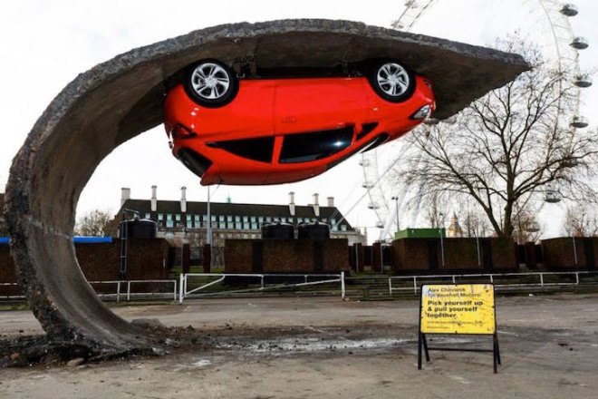 Alex Chinneck, gravity-defying artwork, art installation, ‘Pick yourself up and pull yourself together,’ Vauxhall Motors, Vauxhall Corsa, illusory artwork, tarmac, temporary art,