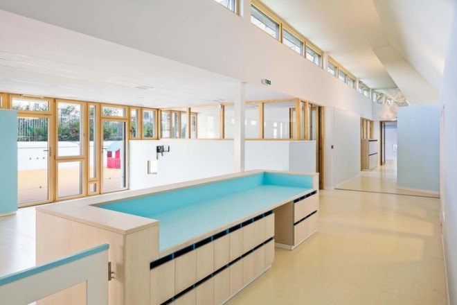 the paper nursery, wild rabbits architects, paris, france, french architecture, paris nursery school, paris nursery, childrens spaces, hidden building, rooftop garden, rooftop grass, good use of natural light, interior glass doors for light, vladimir doray