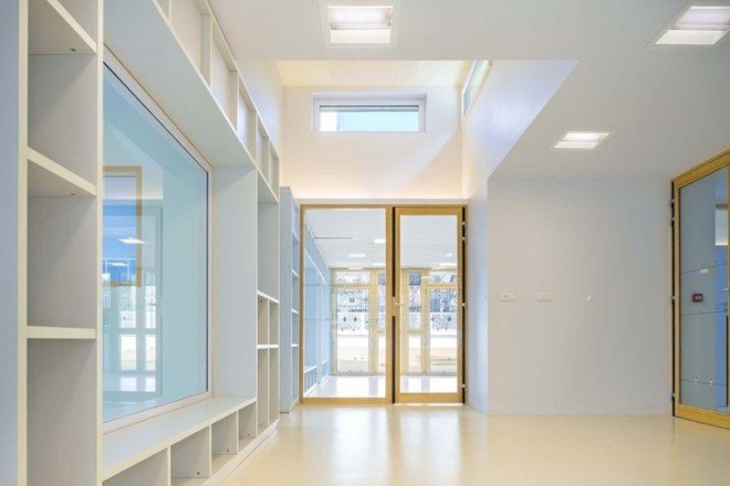 the paper nursery, wild rabbits architects, paris, france, french architecture, paris nursery school, paris nursery, childrens spaces, hidden building, rooftop garden, rooftop grass, good use of natural light, interior glass doors for light, vladimir doray