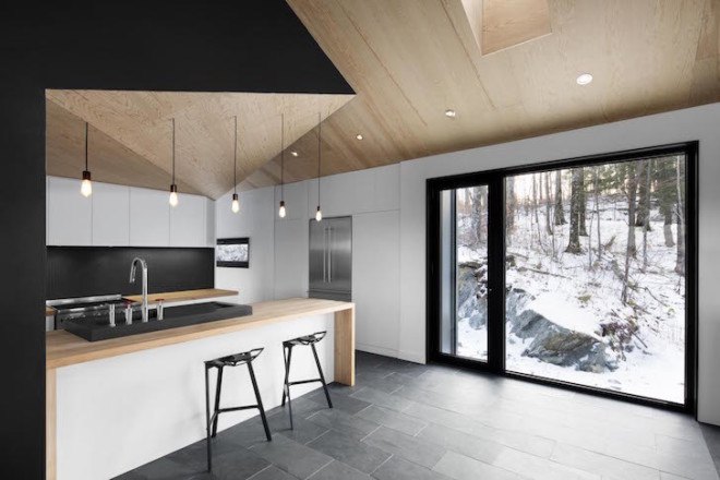 Bolton Residence, mnimalist cabin, cabin, Quebec, Naturehumaine, locally sourced material, timber frame, passive ventilation, slow-combustion fireplace, Eastern Townships, natural plateau, gabled, cantilevered, Bolton Residence by Naturehumaine