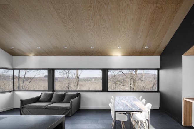 Bolton Residence, mnimalist cabin, cabin, Quebec, Naturehumaine, locally sourced material, timber frame, passive ventilation, slow-combustion fireplace, Eastern Townships, natural plateau, gabled, cantilevered, Bolton Residence by Naturehumaine