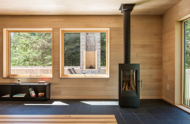 Salmela Architects, cabin, lakeside cabin, V-shaped roof, Family Retreat, sauna, aging cedar, basswood, clear basswood, paper-resin composite, timber cabin, cantilevered, gallery, timber gallery, Lake Superior, Wisconsin,