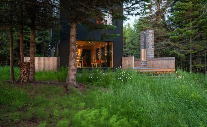 Salmela Architects, cabin, lakeside cabin, V-shaped roof, Family Retreat, sauna, aging cedar, basswood, clear basswood, paper-resin composite, timber cabin, cantilevered, gallery, timber gallery, Lake Superior, Wisconsin,