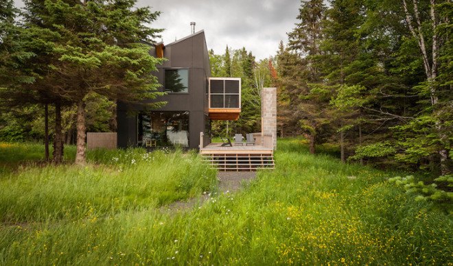 Salmela Architects, cabin, lakeside cabin, V-shaped roof, Family Retreat, sauna, aging cedar, basswood, clear basswood, paper-resin composite, timber cabin, cantilevered, gallery, timber gallery, Lake Superior, Wisconsin,