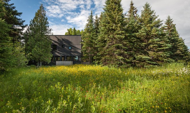 Salmela Architects, cabin, lakeside cabin, V-shaped roof, Family Retreat, sauna, aging cedar, basswood, clear basswood, paper-resin composite, timber cabin, cantilevered, gallery, timber gallery, Lake Superior, Wisconsin,
