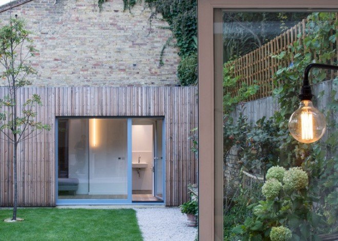 Haptic Architects, Victorian house, London, London architects, green renovation, green extension, untreated timber, timber facade, wooden facade, wooden cladding, skylights, wooden stairs, concrete fireplace