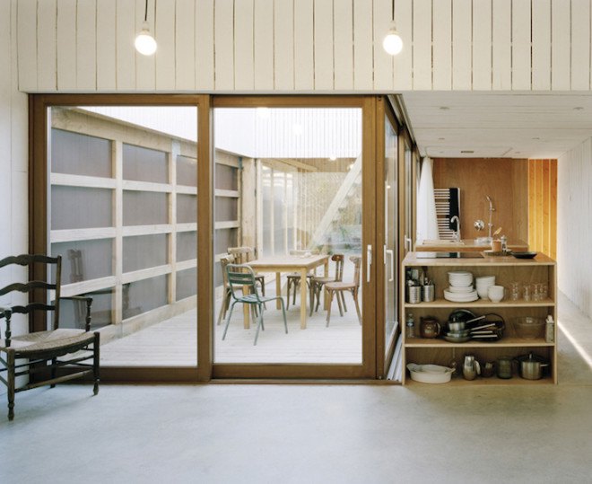 Raum architects, oyster shack, oyster hangar, France, Bretagne, oyster house, timber frame, black stained timber, white timber, minimalist, minimalist design, oyster farmer, green roof
