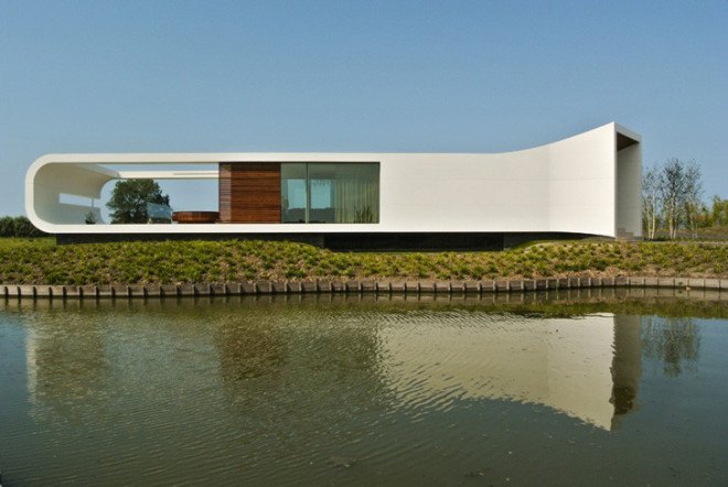 Villa New Water, Waterstudio.NL, waterfront family house, waterfront architecture, The Netherlands, natural lighting, waterfront villa, bamboo, glass facade