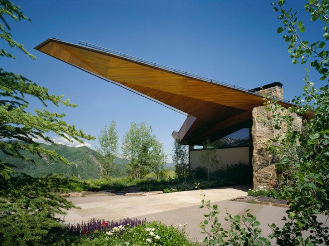 sandstone, black walnut, Wildcat Ridge Residence, Voorsanger Architects, Aspen, Colorado, geothermal energy, geothermal well, floor to ceiling glass, panoramic views, mountains, mountain ridge, Rocky mountains, moss rock wall