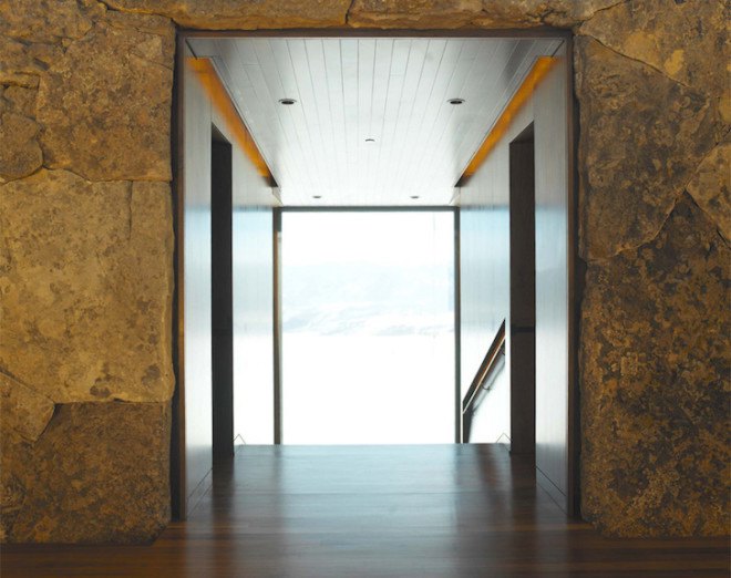 sandstone, black walnut, Wildcat Ridge Residence, Voorsanger Architects, Aspen, Colorado, geothermal energy, geothermal well, floor to ceiling glass, panoramic views, mountains, mountain ridge, Rocky mountains, moss rock wall