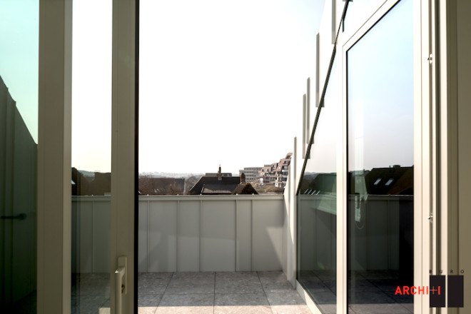 Blanco Oostduinkerke Residence, BURO II & ARCHI+I, Belgium, aluminum cladding, vernacular, pitched house, marionettes, dune grasses, coastal architecture, contemporary coastal architecture, daylighting, sustainable design, green design, sustainable materials, minimalist design
