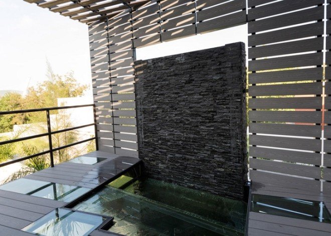 La Capsula, Mexico, Noborders Collective, concrete house, glass facade, green renovation, green addition, courtyard, Mexican architects, green architecture, sustainable building
