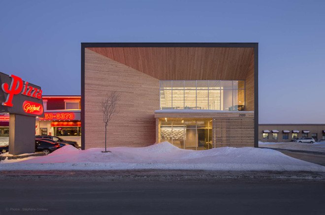STGM Architects, headquarters, Quebec, Canada, office space, natural lighting, water management, energy-efficient building, wooden facade, timber facade, solar wall, green architecture, prefab building, open-plan office, LED lights