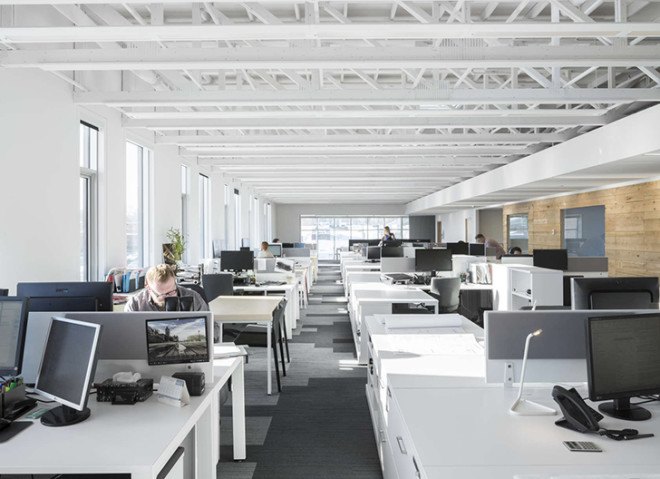 STGM Architects, headquarters, Quebec, Canada, office space, natural lighting, water management, energy-efficient building, wooden facade, timber facade, solar wall, green architecture, prefab building, open-plan office, LED lights