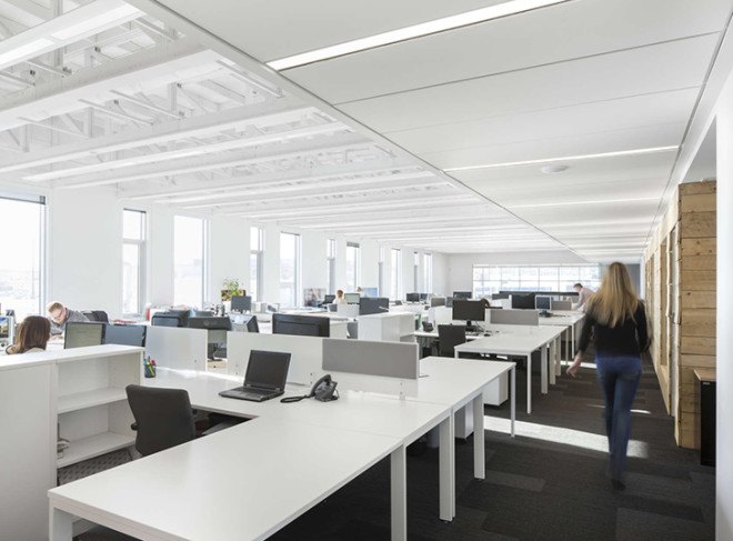 STGM Architects, headquarters, Quebec, Canada, office space, natural lighting, water management, energy-efficient building, wooden facade, timber facade, solar wall, green architecture, prefab building, open-plan office, LED lights