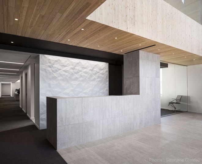 STGM Architects, headquarters, Quebec, Canada, office space, natural lighting, water management, energy-efficient building, wooden facade, timber facade, solar wall, green architecture, prefab building, open-plan office, LED lights