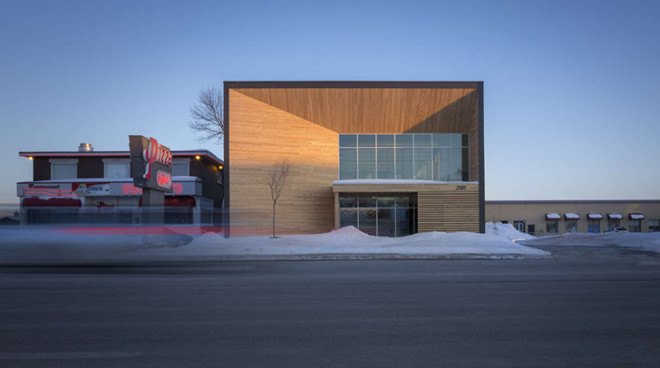 STGM Architects, headquarters, Quebec, Canada, office space, natural lighting, water management, energy-efficient building, wooden facade, timber facade, solar wall, green architecture, prefab building, open-plan office, LED lights