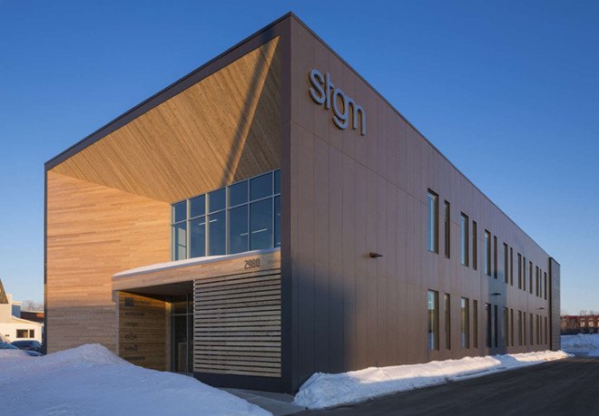 STGM Architects, headquarters, Quebec, Canada, office space, natural lighting, water management, energy-efficient building, wooden facade, timber facade, solar wall, green architecture, prefab building, open-plan office, LED lights