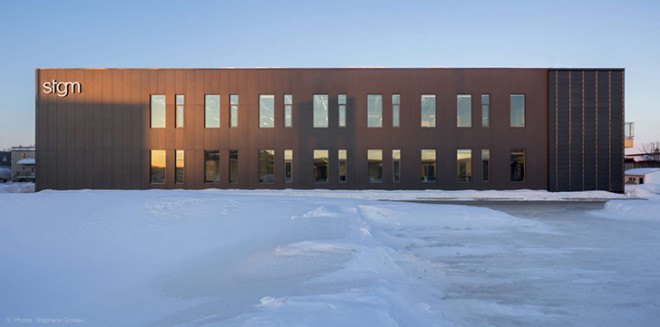STGM Architects, headquarters, Quebec, Canada, office space, natural lighting, water management, energy-efficient building, wooden facade, timber facade, solar wall, green architecture, prefab building, open-plan office, LED lights