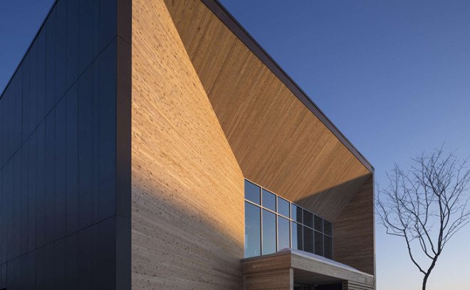 STGM Architects, headquarters, Quebec, Canada, office space, natural lighting, water management, energy-efficient building, wooden facade, timber facade, solar wall, green architecture, prefab building, open-plan office, LED lights