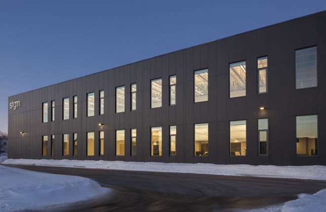STGM Architects, headquarters, Quebec, Canada, office space, natural lighting, water management, energy-efficient building, wooden facade, timber facade, solar wall, green architecture, prefab building, open-plan office, LED lights