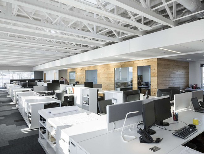 STGM Architects, headquarters, Quebec, Canada, office space, natural lighting, water management, energy-efficient building, wooden facade, timber facade, solar wall, green architecture, prefab building, open-plan office, LED lights