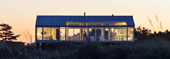 Alric Galindez, RM House, house on stilts, grassy Pampas, glazed facade, natural light, Mar de Ajó, floating house