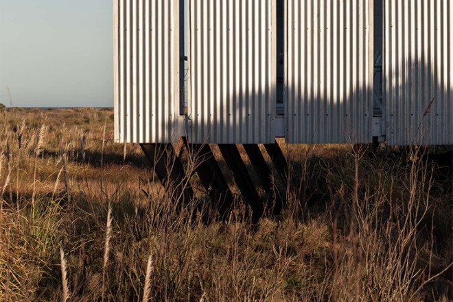 Alric Galindez, RM House, house on stilts, grassy Pampas, glazed facade, natural light, Mar de Ajó, floating house