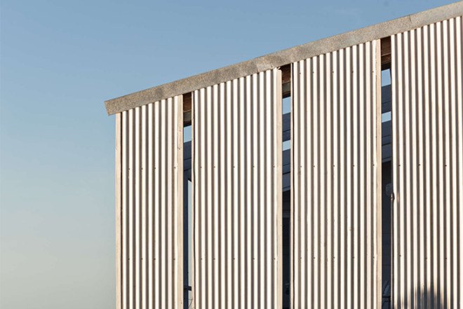 Alric Galindez, RM House, house on stilts, grassy Pampas, glazed facade, natural light, Mar de Ajó, floating house