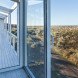 Alric Galindez, RM House, house on stilts, grassy Pampas, glazed facade, natural light, Mar de Ajó, floating house